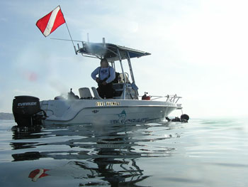 Deploying the International Diver's Flag on a boat